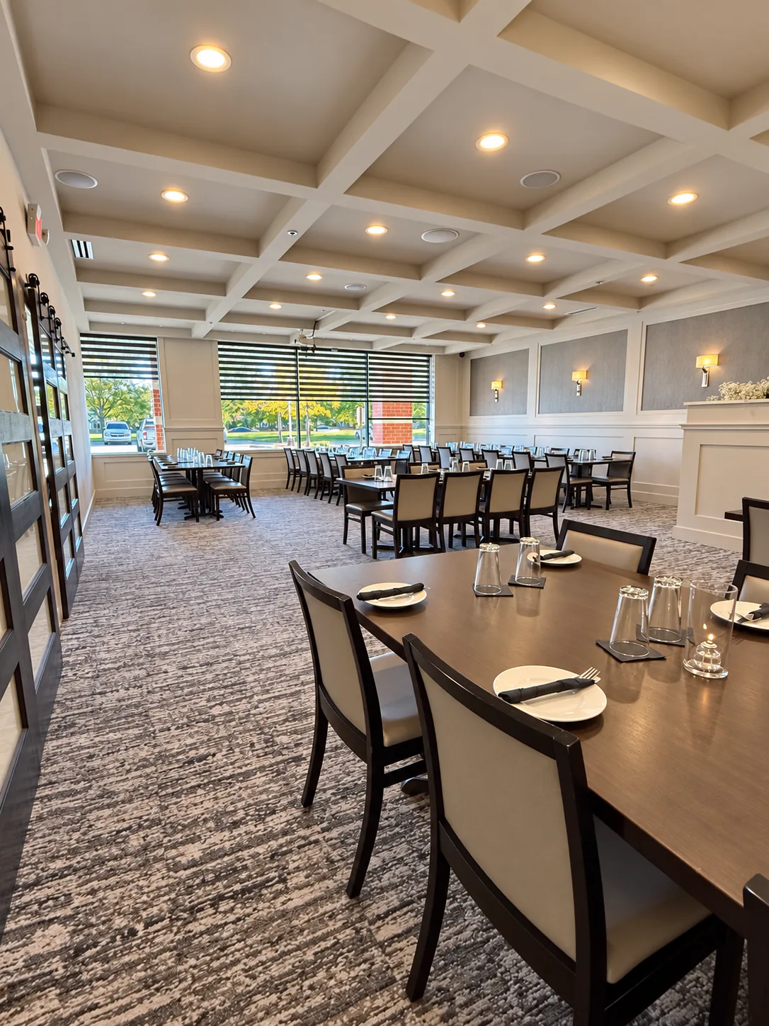 Sunlit banquet hall with tables arranged for a private event